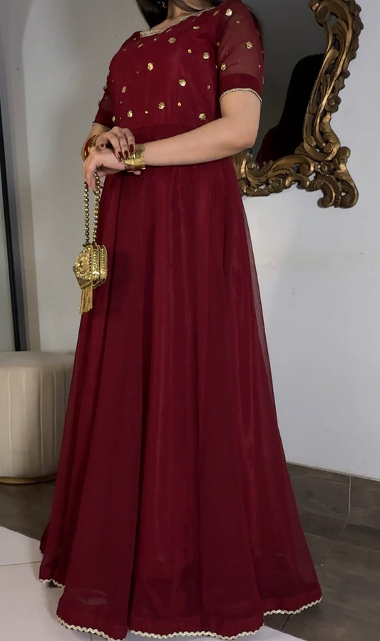 Burgundy Aatish formal dress showing a fitted embellished bodice, short sleeves and wide kalidar flare