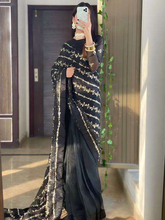 Andleep black organza saree full length side view showing sequin and pearl work