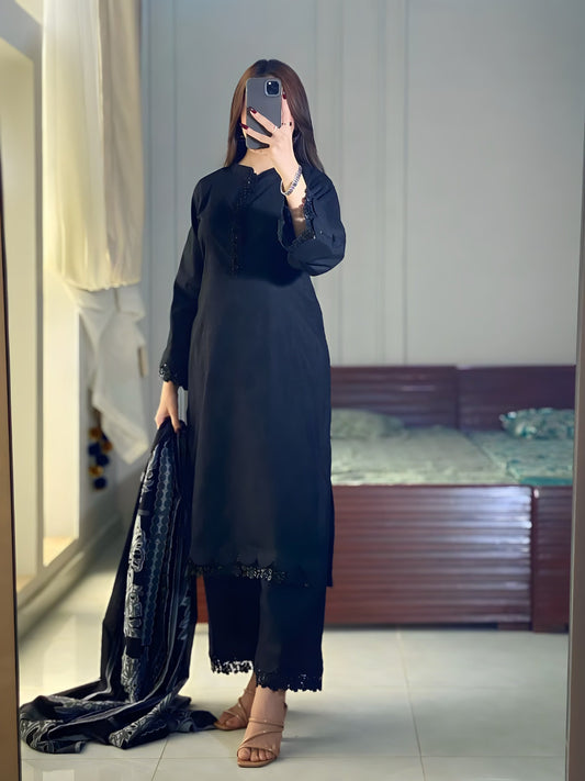 Black Aura black lawn suit full length with printed dupatta held in hand