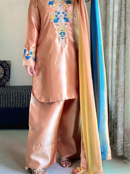 Aab-e-Noor peach Katan silk Farshi shalwar with wide flare paired with three-shade chiffon dupatta