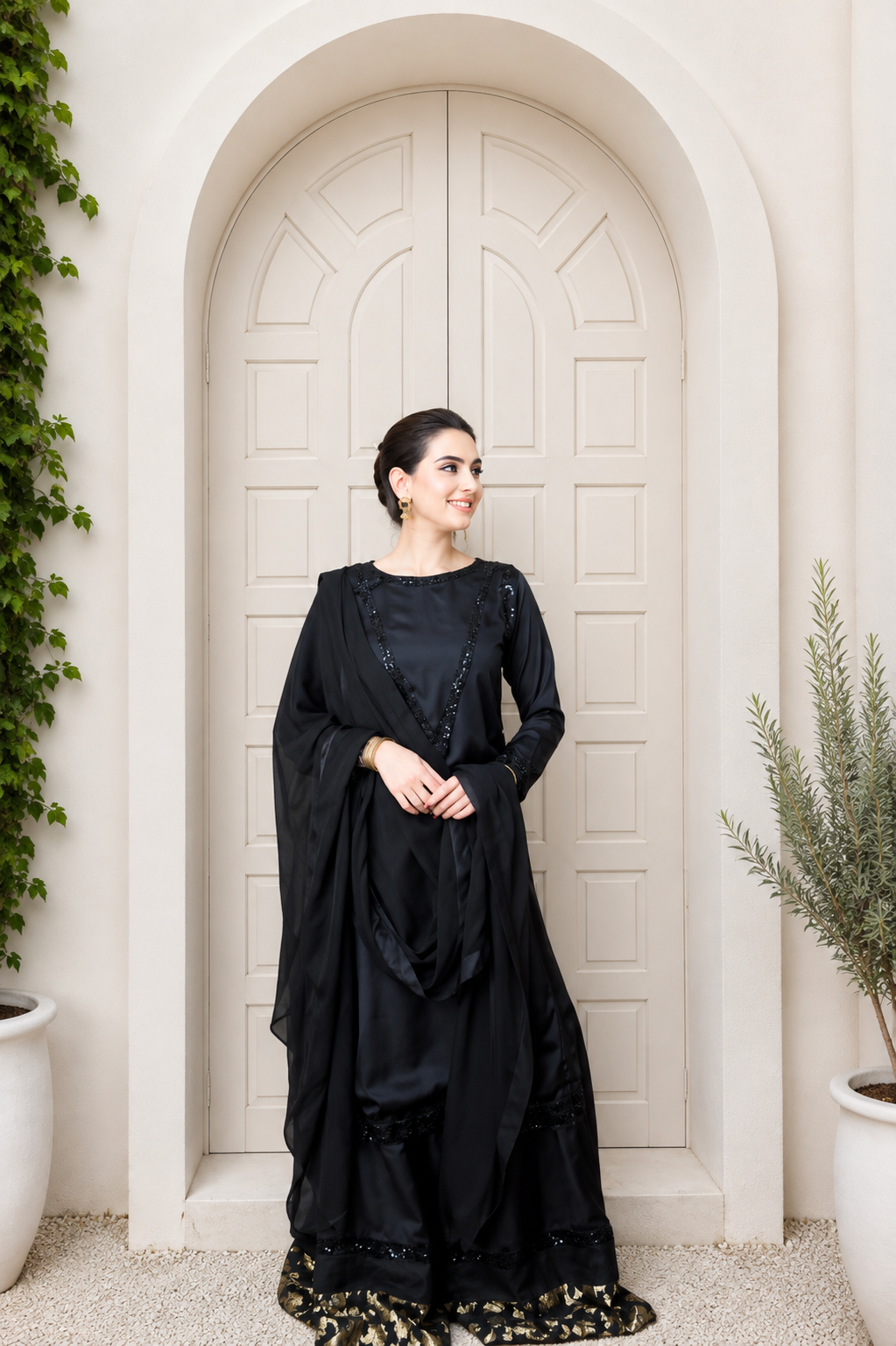Elara black embroidered silk 3-piece palazzo suit with matching dupatta, front angled view | Anabiyawear