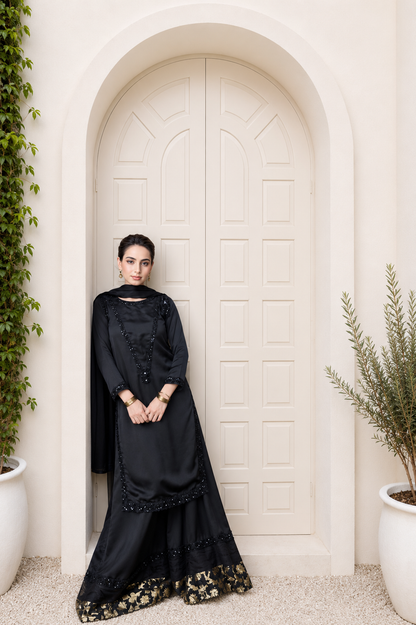 Elara black embroidered silk 3-piece palazzo suit with detailed hem, full-length front view | Anabiyawear