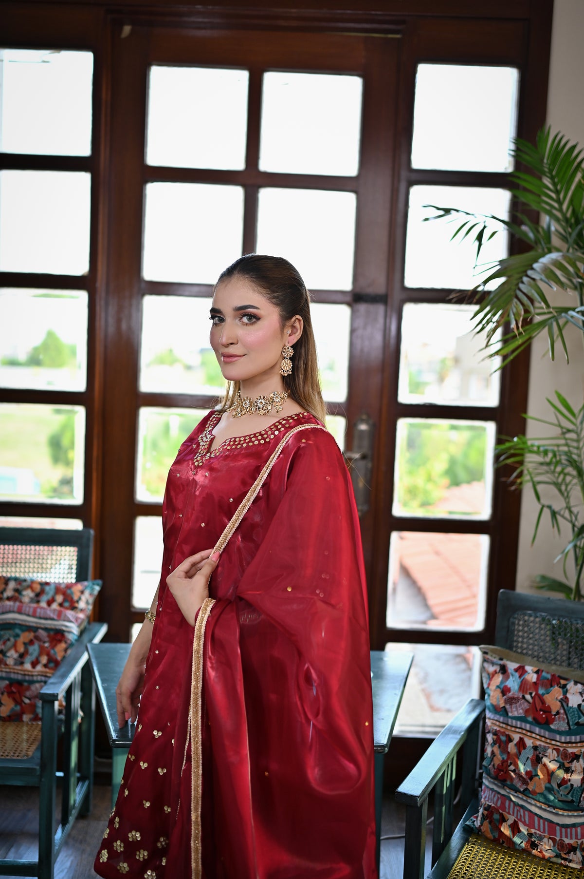 Shah Gul deep red Shesha silk ensemble styled with matching dupatta and handcrafted embellishments