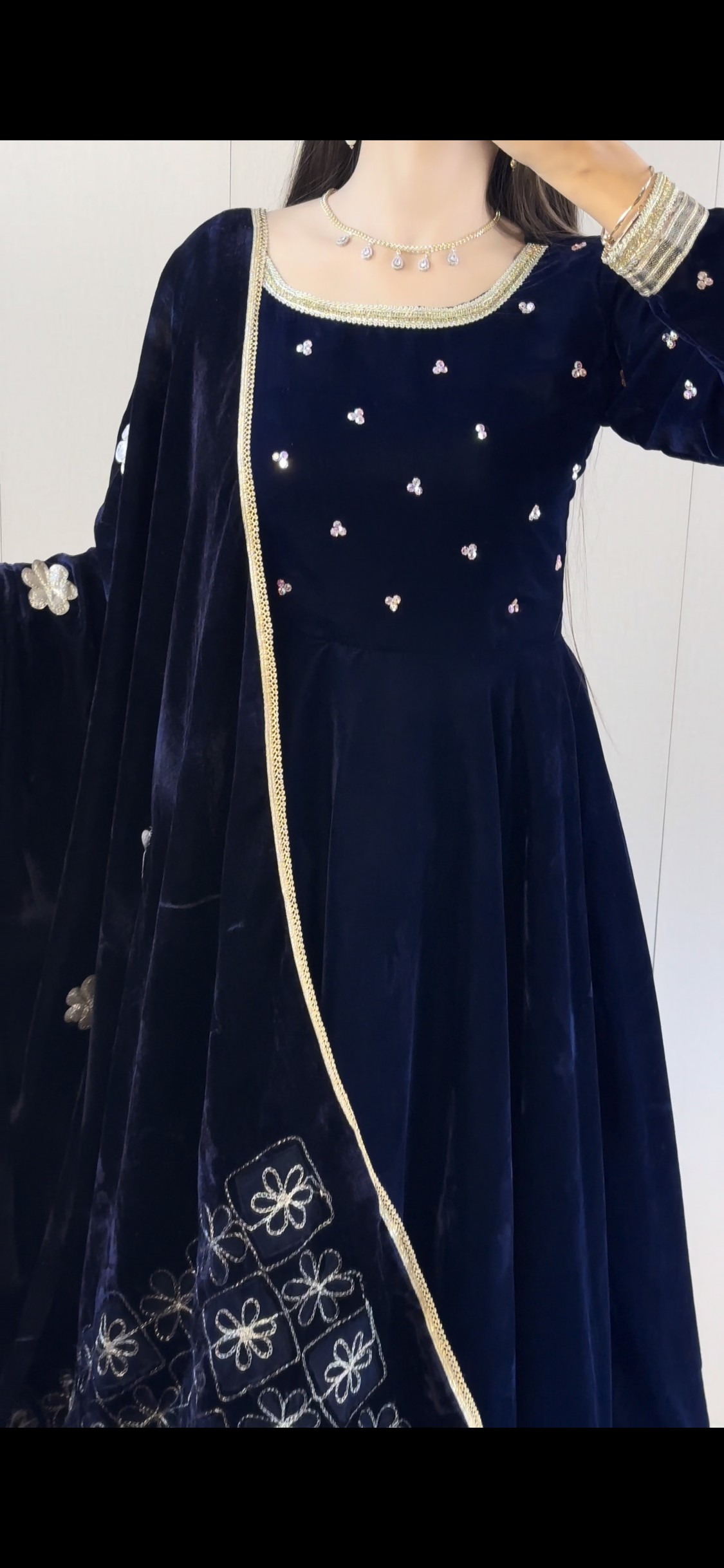 Close detail of Afreen navy velvet maxi showing rhinestone neckline accents and contrasting velvet shawl border