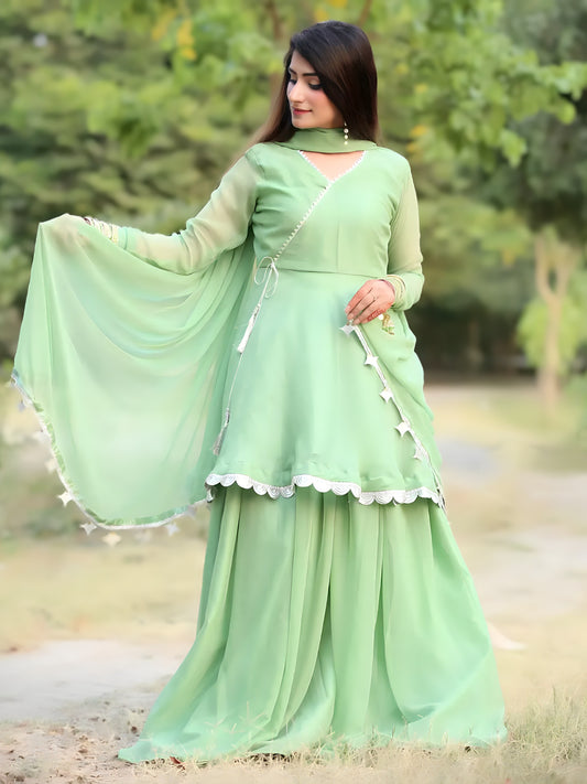 Angrakha Pista suit with chiffon dupatta spread, silver lace and star tassels