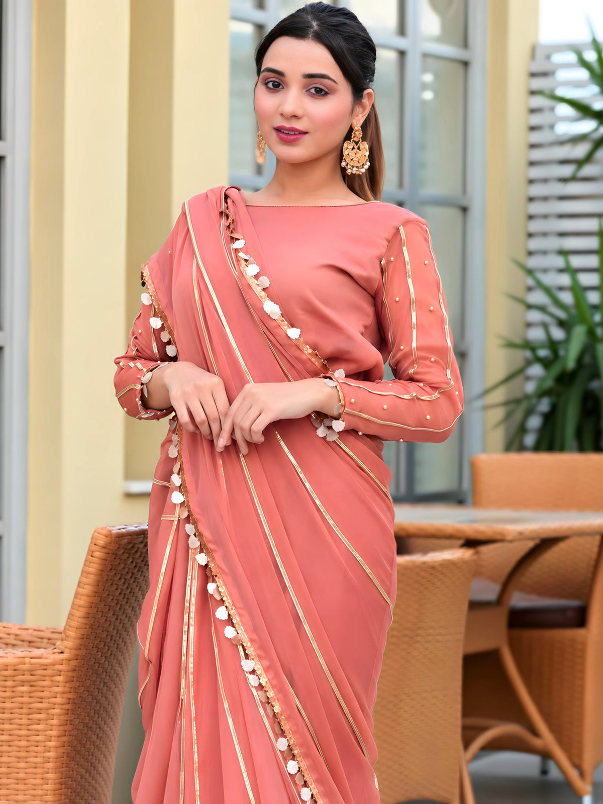 Close up of Aster chiffon saree pallu with tassel lace border and gota stripes