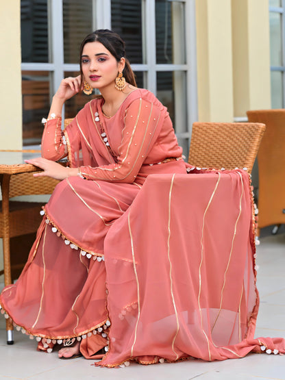 Aster chiffon lace saree sitting front pose with boat neck blouse and gota work