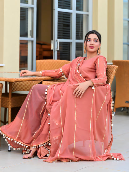 Aster chiffon lace saree sitting side pose with full sleeve blouse and pearl detailing