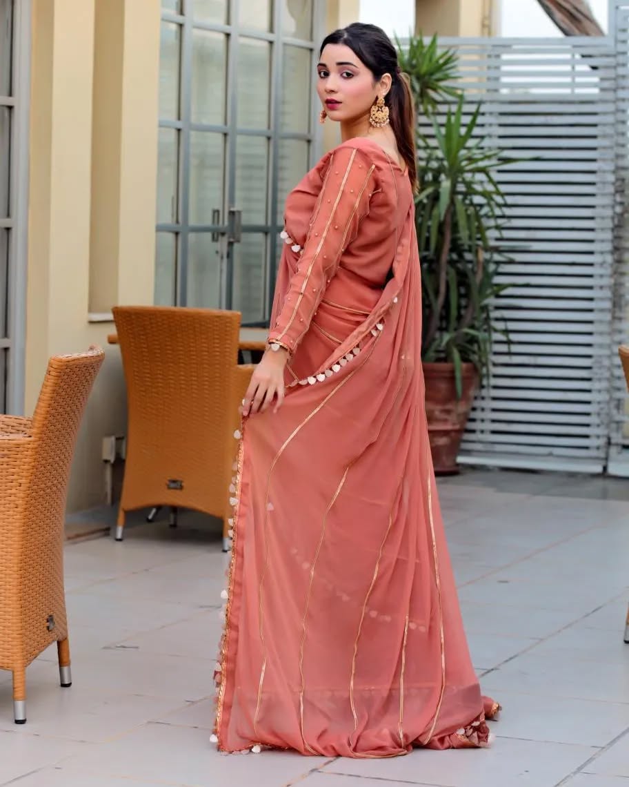 Aster Dusty Rose chiffon saree in side-back pose showing flowing drape and lace border detailing by Anabiyawear