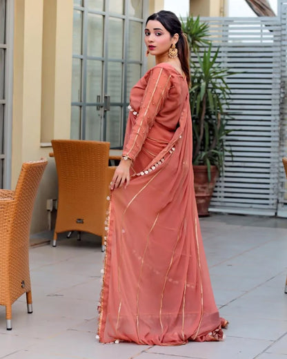 Aster Dusty Rose chiffon saree in side-back pose showing flowing drape and lace border detailing by Anabiyawear