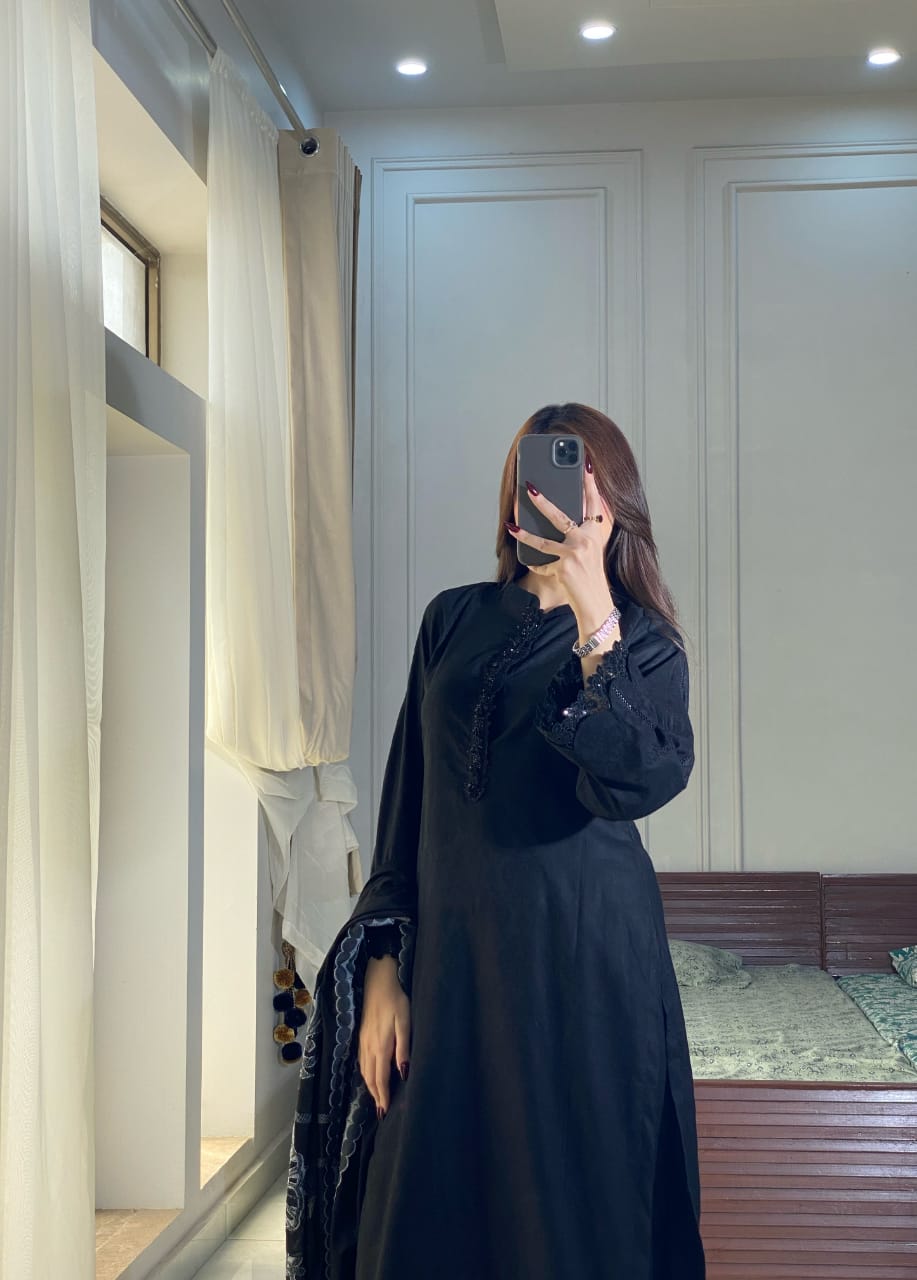 Black Aura black lawn suit close view highlighting the boat neckline, lace finished sleeves and clean straight shirt design