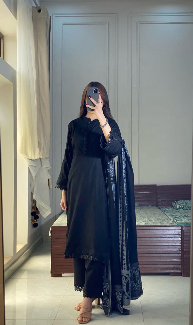 Black Aura three piece lawn outfit in a full standing pose with draped jacquard dupatta, straight black shirt and matching trousers