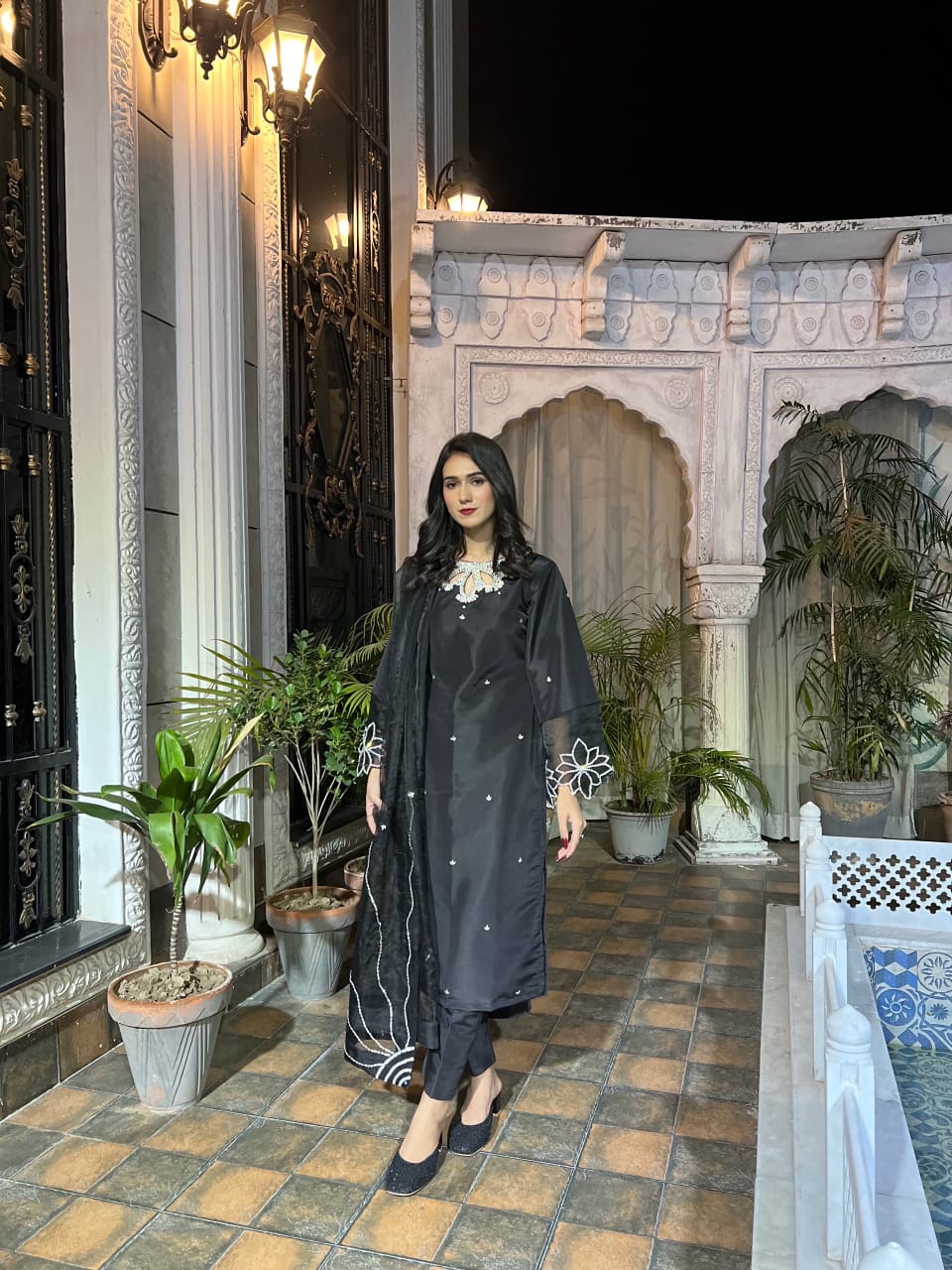Full-length Bulbul Black 3 piece with Katan silk shirt, silver embellishment and organza dupatta in a standing pose