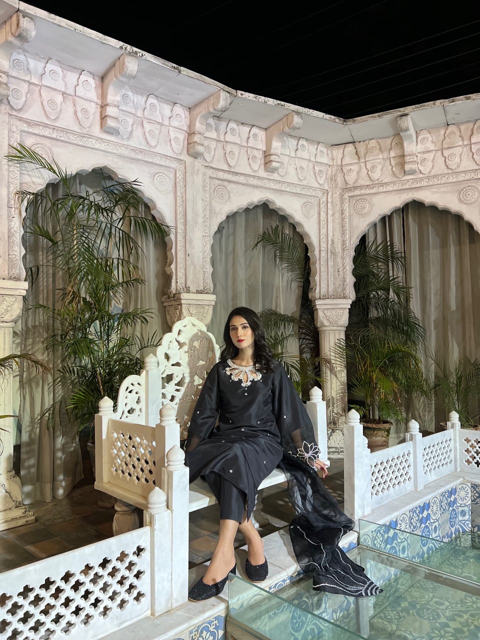 Bulbul Black 3 piece styled in a seated setting with Katan silk shirt, organza dupatta and silver crystal work