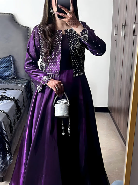 Model in Flora Plum frock with jacket holding the matching potli bag, front pose