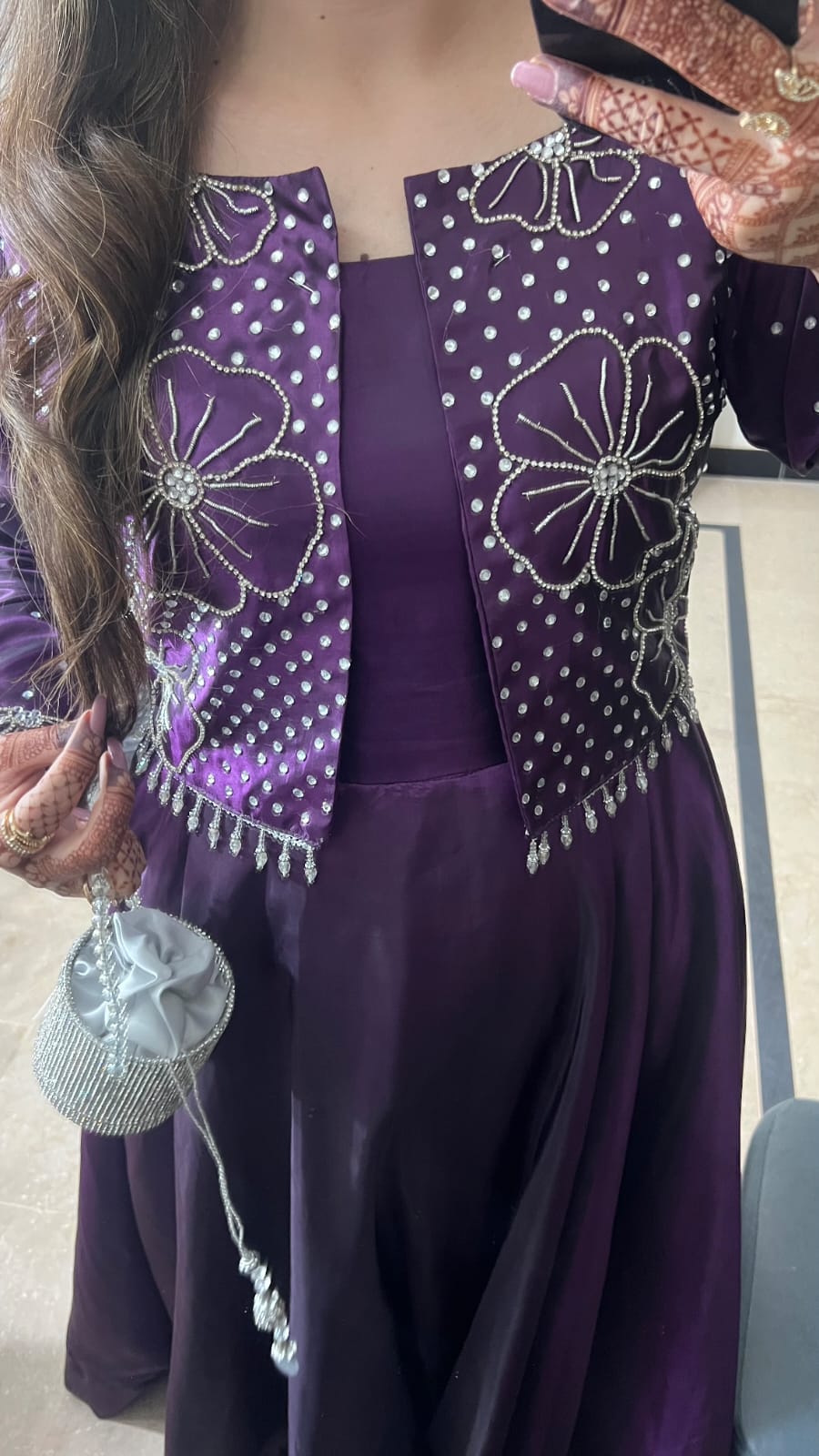 Flora Plum frock close-up highlighting embellished jacket panels, silver motif work and smooth plum Katan silk flare