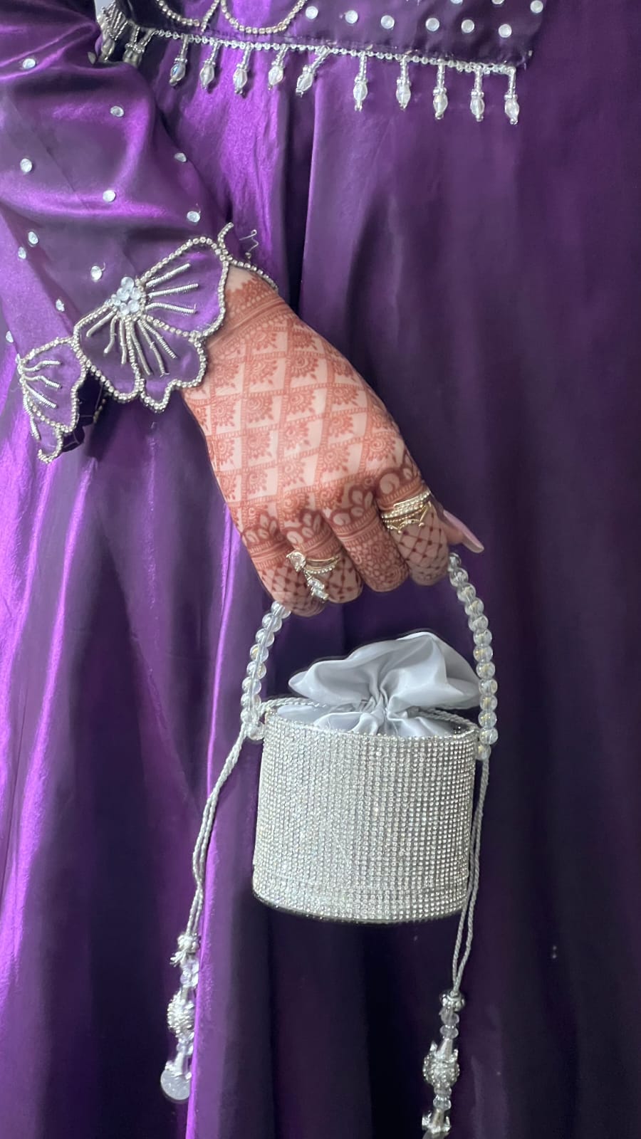 Flora Plum frock close-up showing embellished sleeve cuff, silver motif work and plum Katan silk fabric