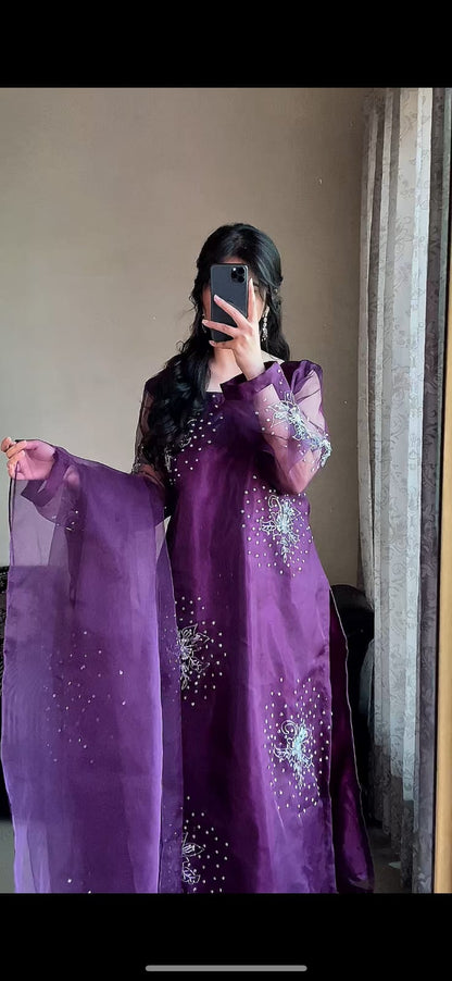 Gulshan Purple organza three piece suit with open dupatta pose, sequin and cutdana detailing on the long purple shirt