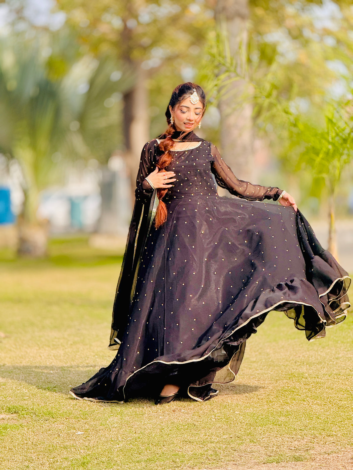 Jhomer flared frock showing ruffle hem and silver mukesh detailing by Anabiyawear