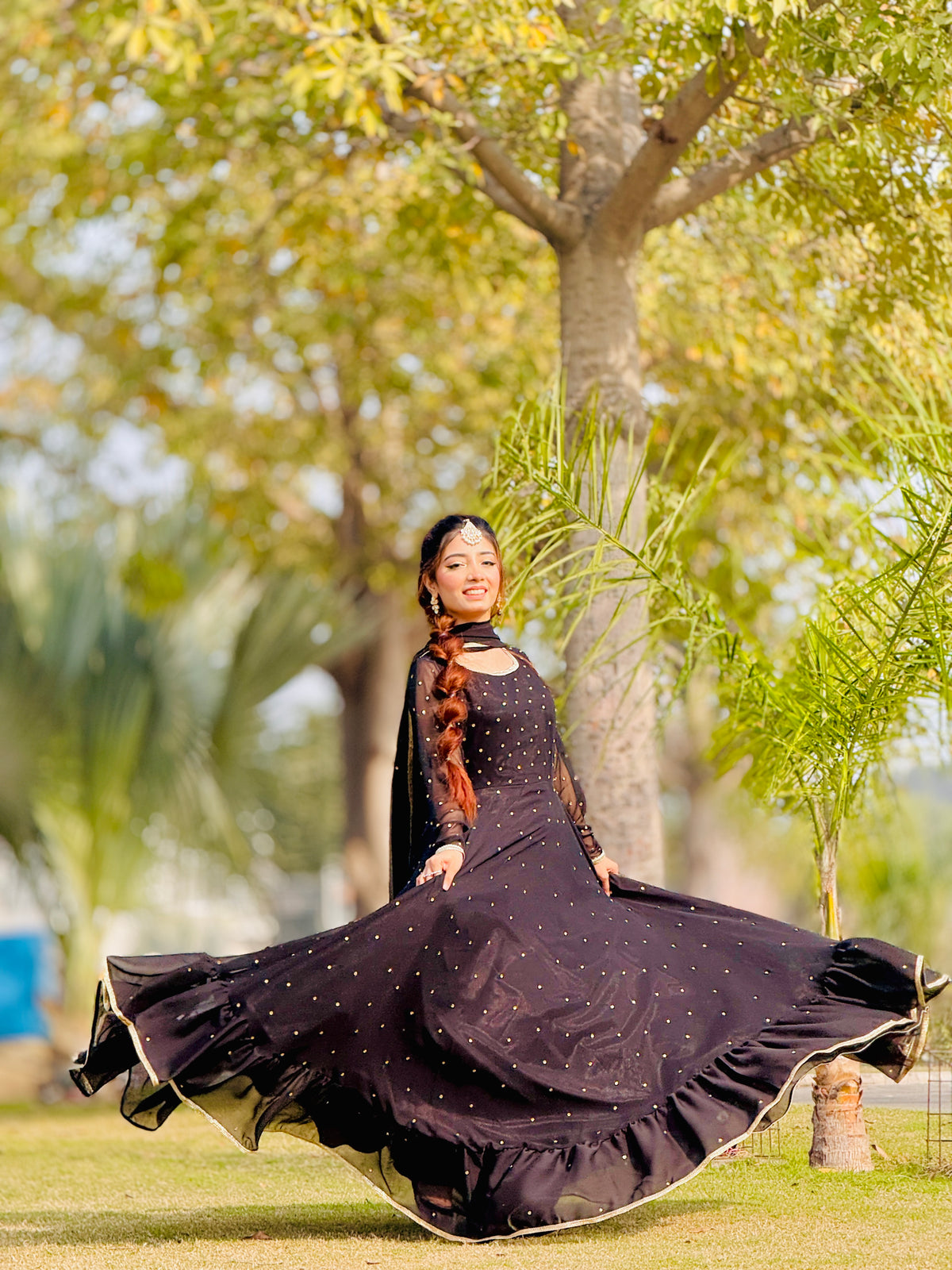 Jhomer dark frock in motion showing wide flare and silver mukesh detailing by Anabiyawear