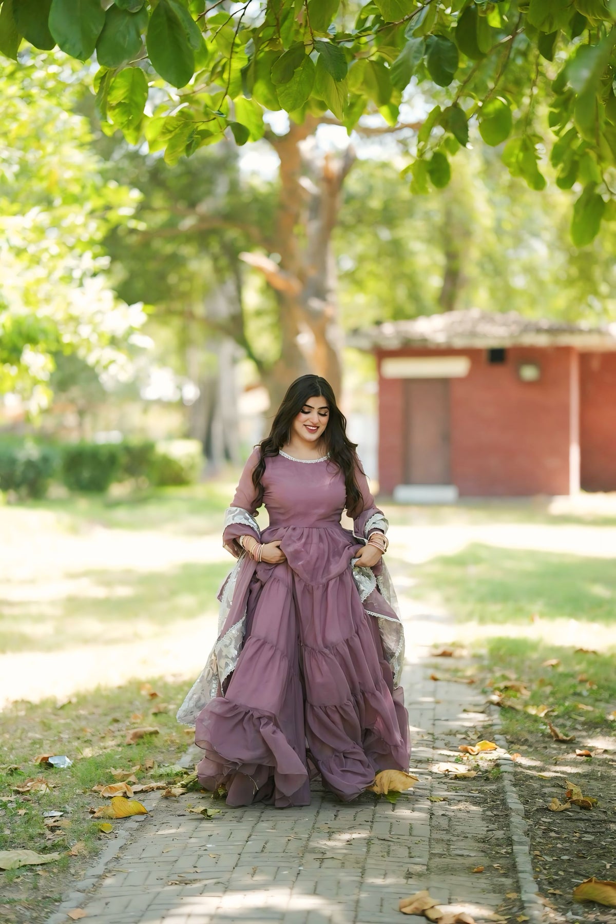 Leela Mauve chiffon frock shown in a full standing look with tiered skirt, long sleeves and soft flowing silhouette