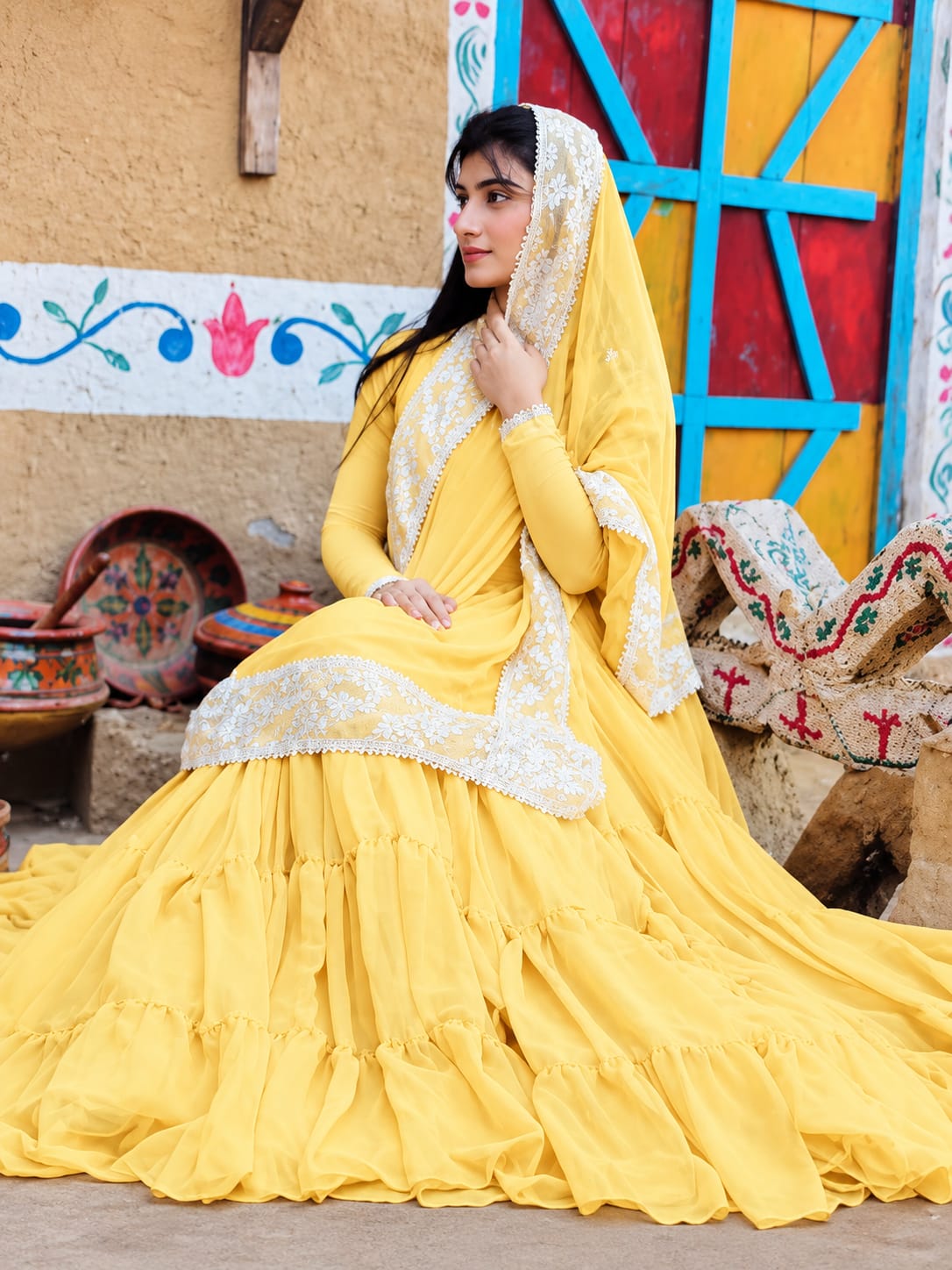 Leela Yellow layered chiffon step frock with matching dupatta in indoor seated look by Anabiyawear