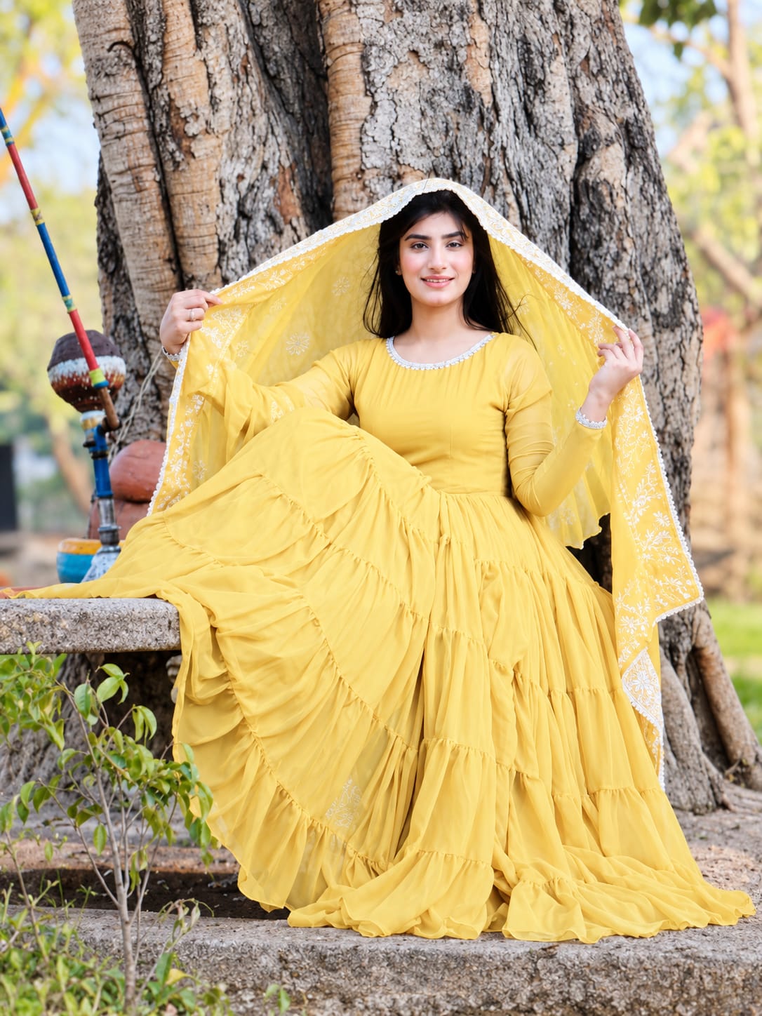Leela Yellow chiffon step frock with matching dupatta in seated pose by Anabiyawear