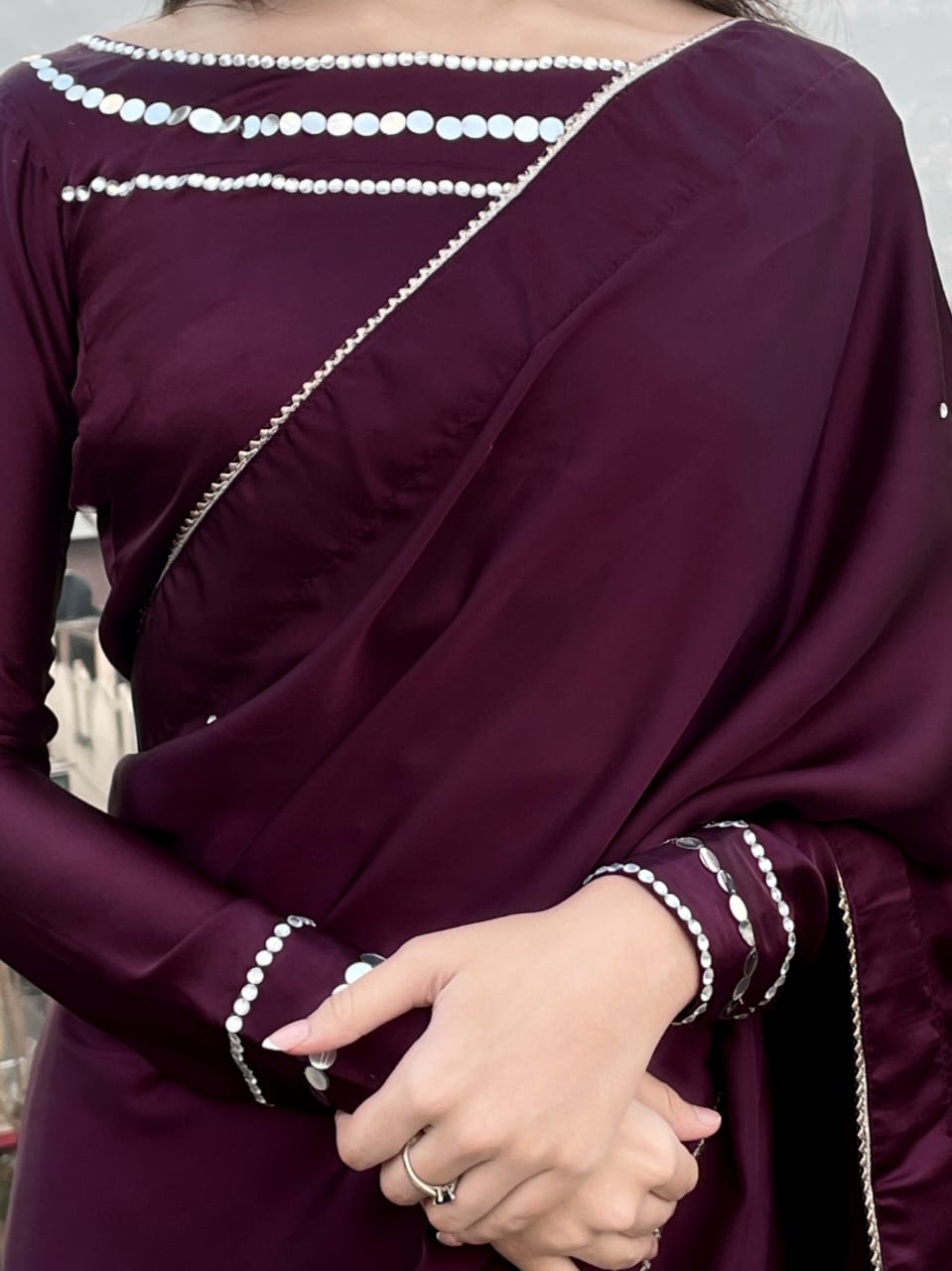 Miran Plum silk saree close-up featuring Shesha lace neckline, Mukesh accents and embellished sleeve cuffs