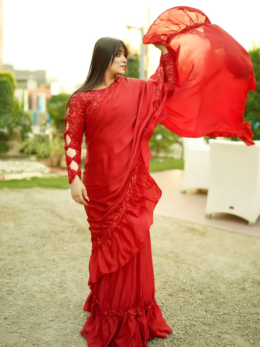 Moonlight Pro Red saree front pose with flowing pallu and ruffle hem