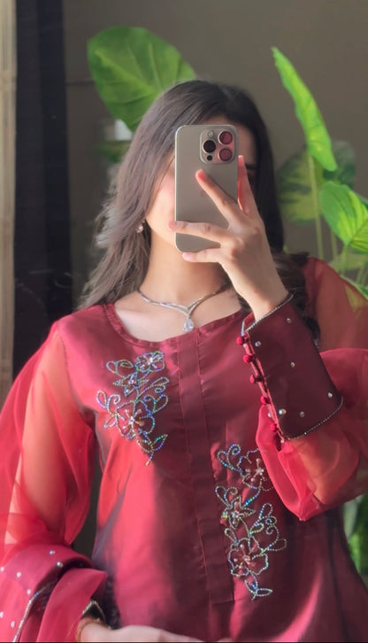 Close-up of Murraya Maroon katan silk shirt highlighting crystal chain motifs, neckline embellishment and detailed sleeve finish
