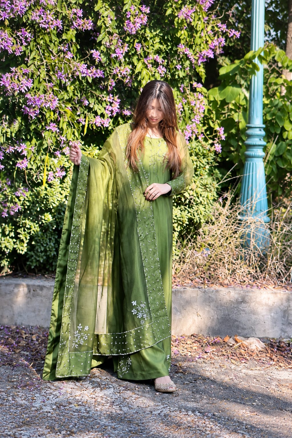 Murrayya leaf green three piece featuring a draped organza dupatta, wide trousers and embellished shirt accents