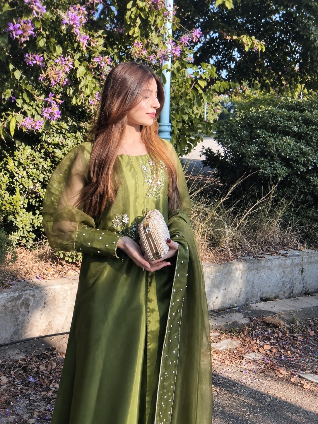 Murrayya leaf green festive outfit in a side profile with crystal accents, silk shirt and sheer dupatta styling