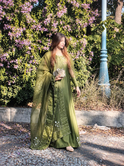 Murrayya leaf green 3 piece shown in a full outdoor look with organza dupatta, crystal work and embellished hem