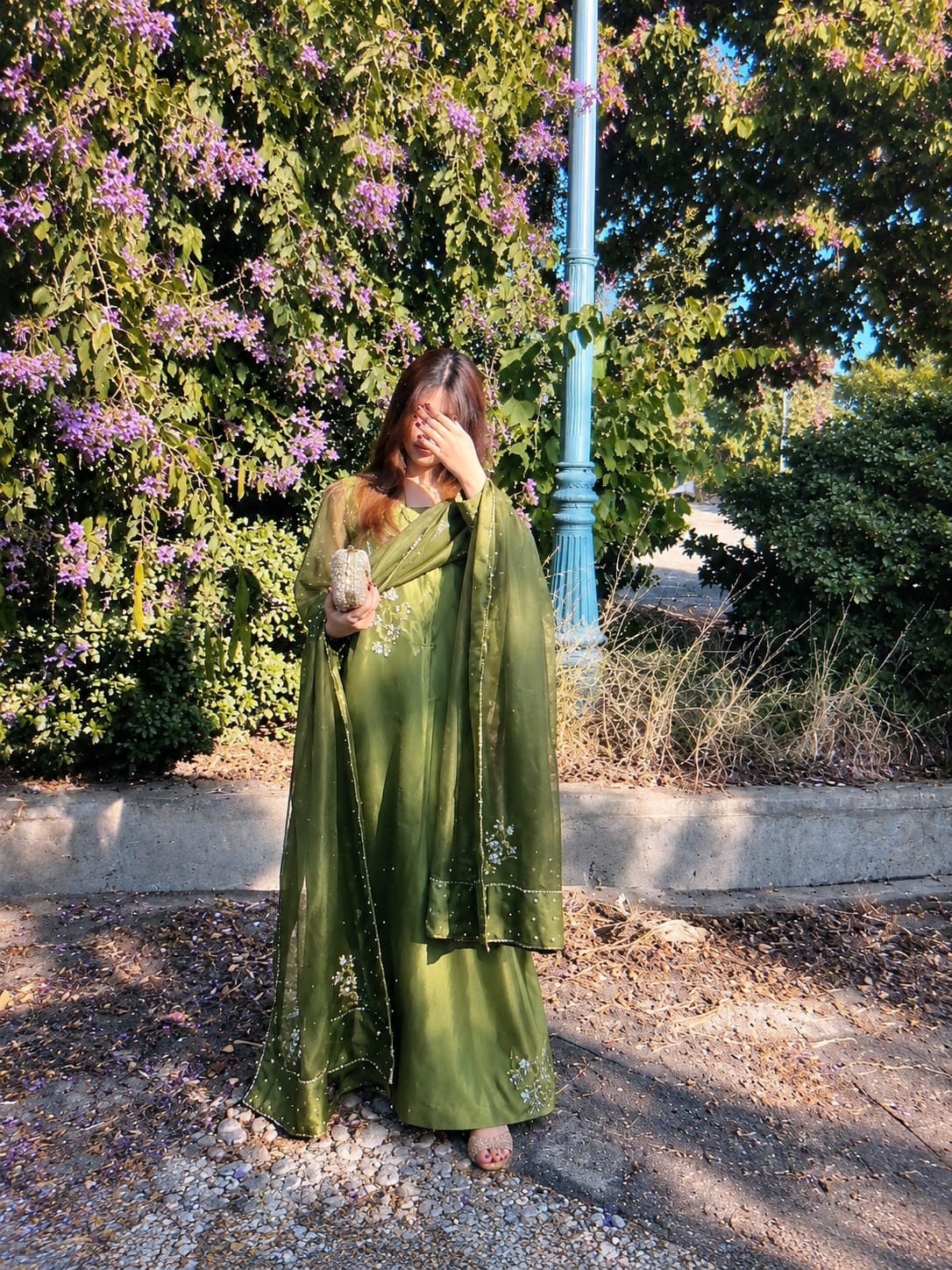 Murrayya leaf green 3 piece styled in a garden setting with a soft organza dupatta and detailed festive finish