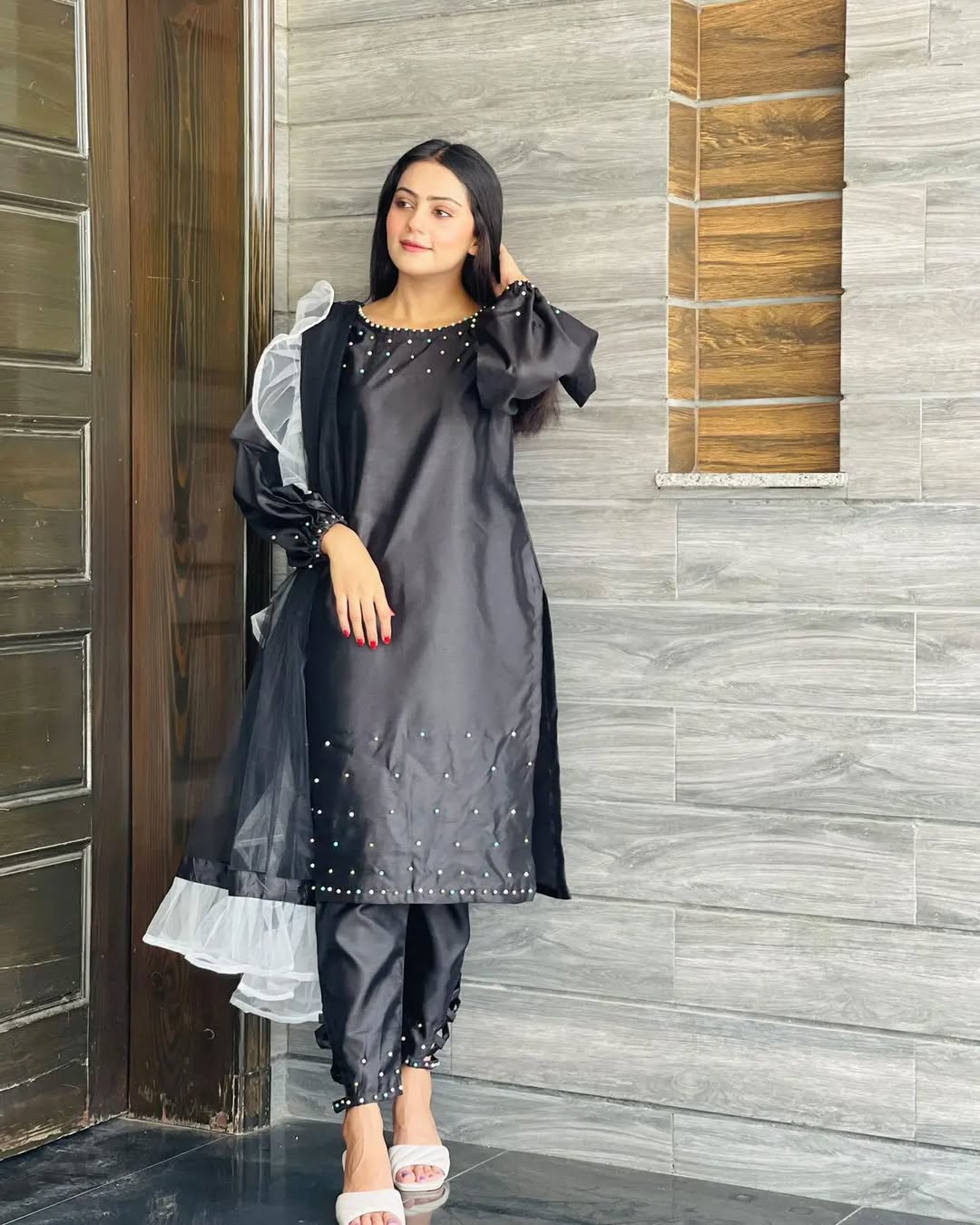 Pearl Black Katan silk capri set in standing pose with pearl-detailed shirt and ruffle dupatta by Anabiyawear