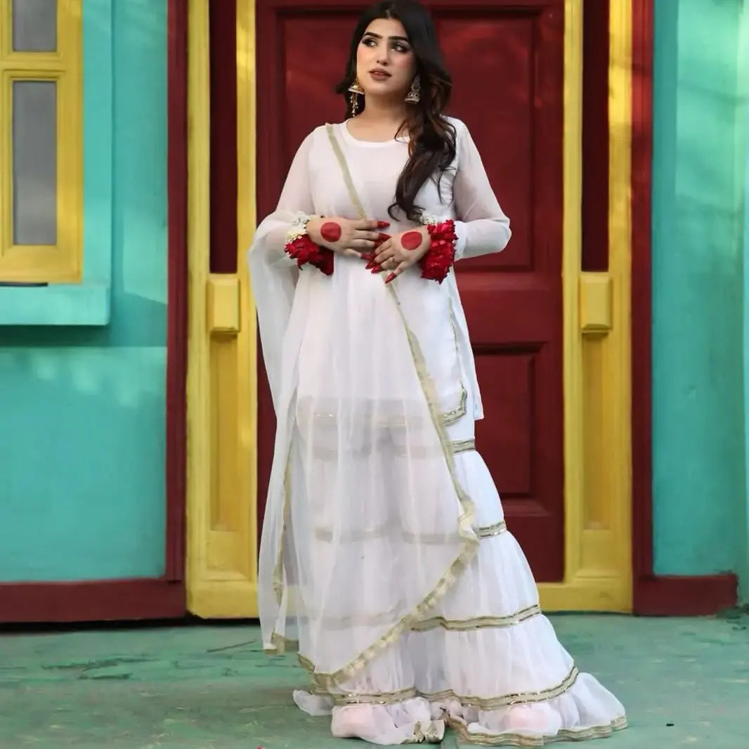 Rebel White chiffon garara set in full-length front view with tiered flared garara and short shirt by Anabiyawear