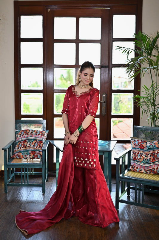 Red festive flared dress with embellished shirt and statement hem detailing