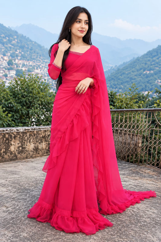Ruffle Bloom fuchsia chiffon saree in an outdoor full-length pose featuring soft ruffle edges and a fitted stone-work blouse