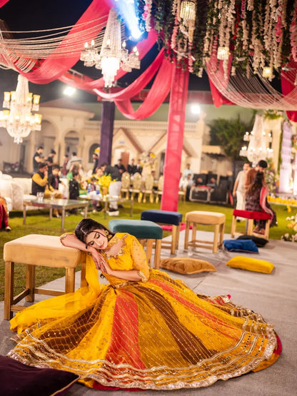 Wide seated view of Signature Mehndi Kali Dar Lehenga Kurti with flared multicolor lehenga