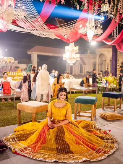 Wide seated view of Signature Mehndi Kali Dar Lehenga Kurti with flared multicolor lehenga
