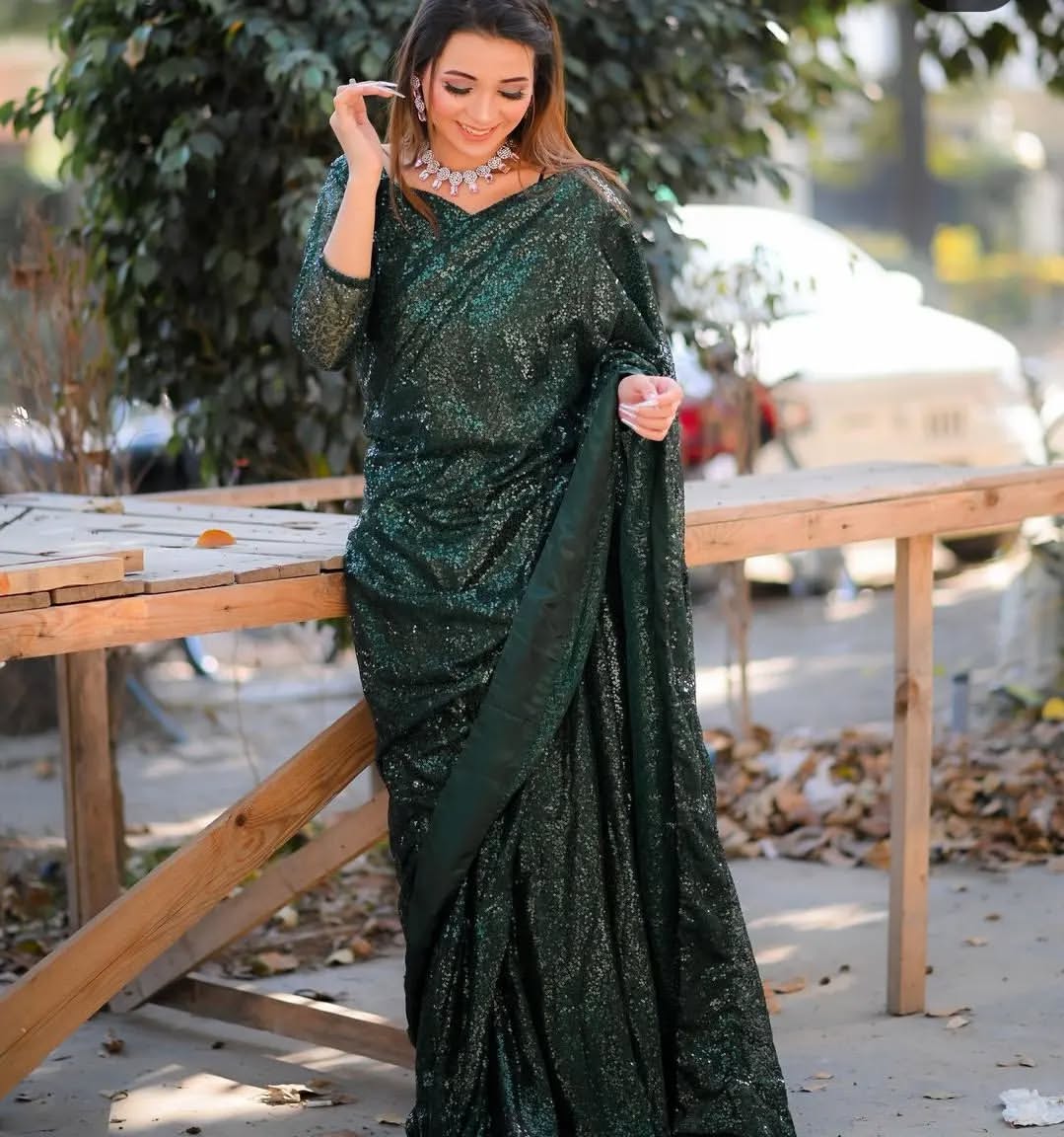 Snowdrop Bottle Green sequin net saree with stitched blouse and draped pallu by Anabiyawear