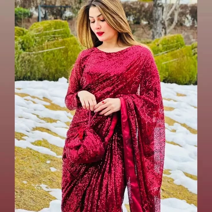 Snowdrop Maroon sequin net saree close view highlighting the draped pallu and stitched blouse by Anabiyawear