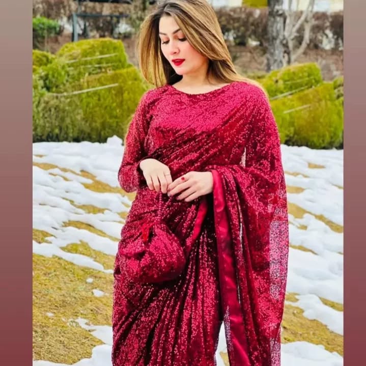 Close-up of Snowdrop Maroon sequin net saree showing textured drape and long-sleeve blouse by Anabiyawear