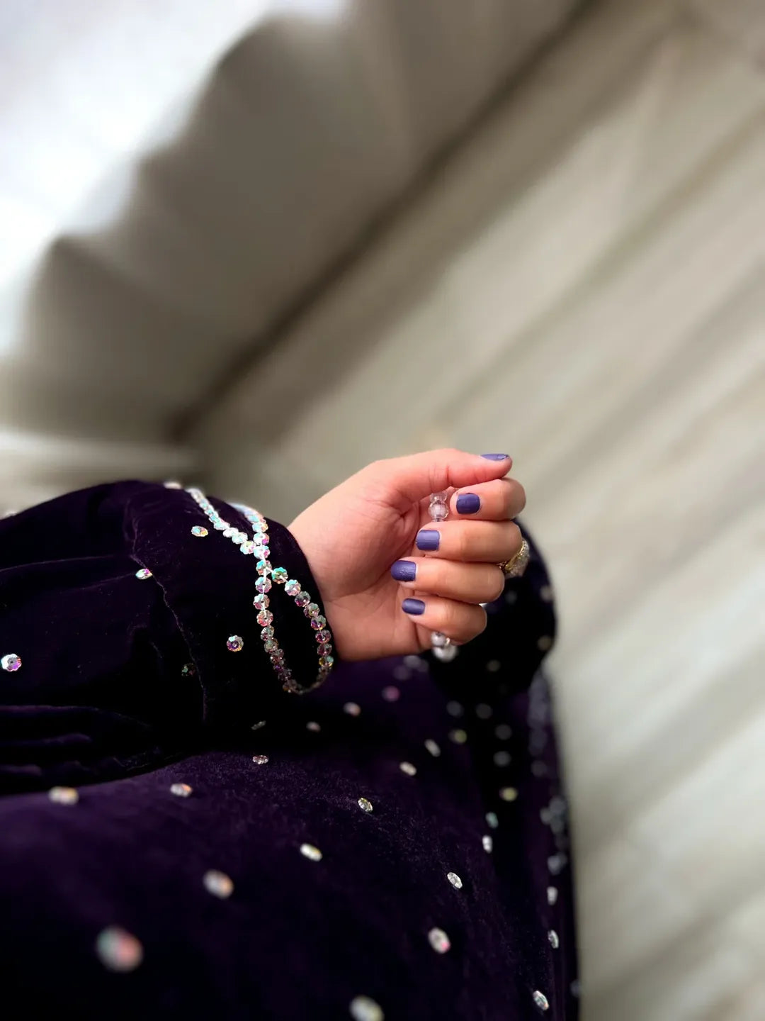 Close-up of Velvet Gazal Plum sleeve cuff with crystal stone accents and detailed velvet finishing